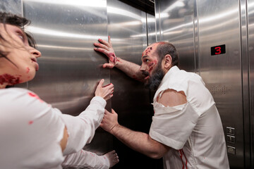 Feral ghouls stuck in office building elevator, trying to escape to infect more people and consume...