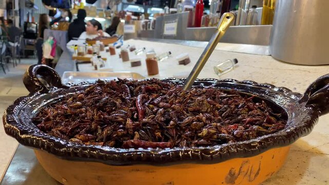 Fried grasshoppers, known as Chapulines, are seen for sell as exotic foods in the traditional San Juan public Market located in downtown Mexico City, Mexico.