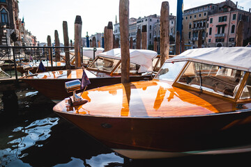Elegant Venetian Water Taxis Moored at a Picturesque Dock in Venice's Historic Canal District