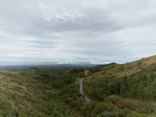 A lonely mountain road with a beautiful sky in the background