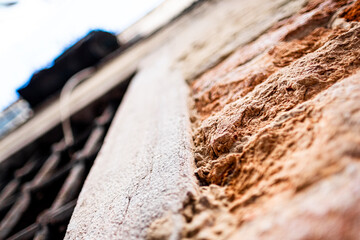 Close-Up of Textured Stone Wall in Venice Highlighting Architectural Details and Rustic Charm