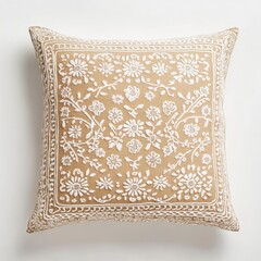 A decorative pillow featuring floral embroidery on a beige background.