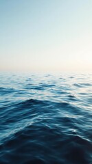 Ocean surface with a calm and peaceful atmosphere and gentle ripples, soft ripples, ocean scenery, blue skies, serene sea