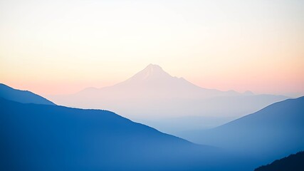 Obraz premium Serene mountain landscape at dawn, showcasing a majestic peak and rolling hills bathed in soft, pastel light