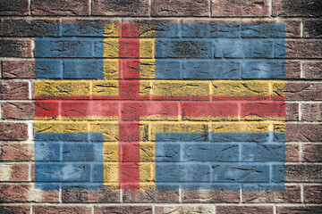 Aland Islands flag on a brick wall background