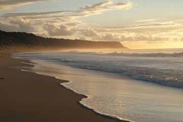 Obraz premium serene beach landscape at sunset with gentle waves and soft clouds