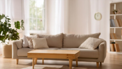 Blurred view of light living room with sofa and soft bench