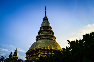 Fototapeta premium Golden Pagoda Lanna Architecture at Wat Phra That Hariphunchai ,Symbols of Buddhism, at Lamphun Northern Thailand,South East Asia