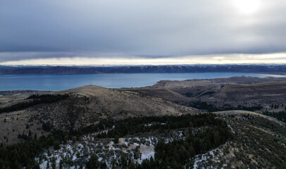Fantastic dreamy sunrise on top of rocky mountain with view into misty valley. Mountain Lake view. USA