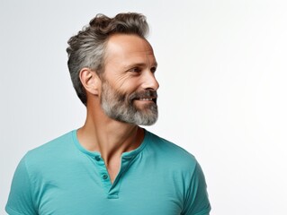 Fototapeta premium smiling man with gray hair and beard looking to the side