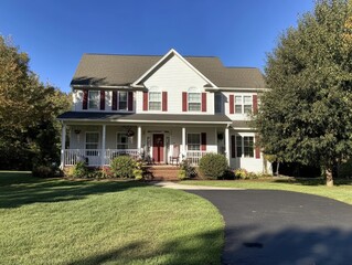 Fototapeta premium beautiful suburban home with a well-maintained yard and driveway