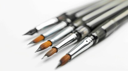 A close-up of various artistic paintbrushes lined up, showcasing their different bristle shapes and sizes against a clean, white background.