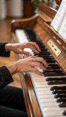 Fototapeta premium A close-up shot focusing on a pianist's hands gracefully playing the keys