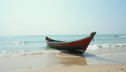Fototapeta premium Tranquil beach scene with a small boat