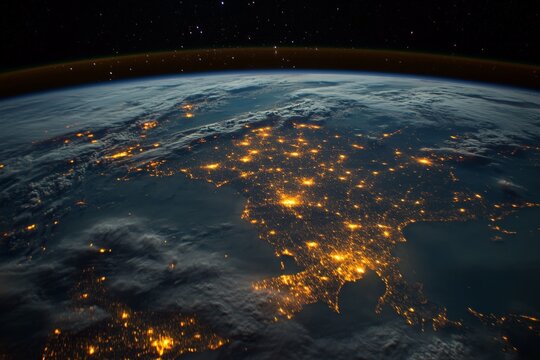 This image captures the illuminated European continent from space, showcasing a dazzling display of city lights against a tranquil dark backdrop, indicating lively urban life.