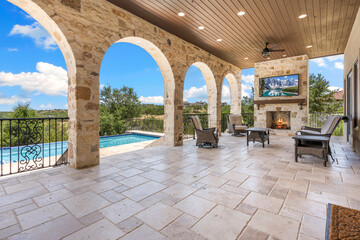 Elegant outdoor patio with stunning views and cozy fireplace setting