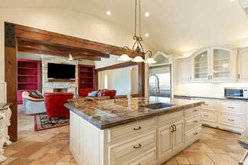 Elegant kitchen with modern design and open layout featuring living area