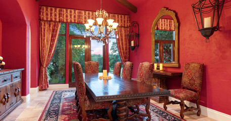 Elegant dining room featuring rich decor and natural light in a cozy setting