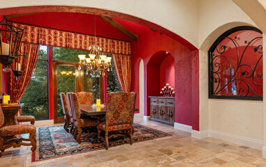 Elegant dining room features rich colors and traditional decor in a cozy home