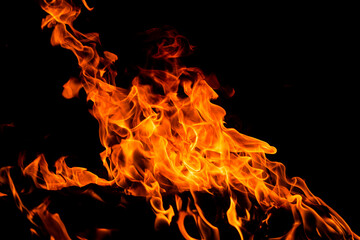Fire flames on black background. Fire sparks background. Abstract dark fire flames background....