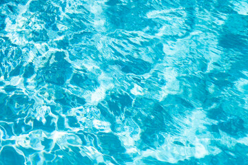 Pool water. Background texture. Water in swimming pool. Rippled water detail background. Blue water surface.