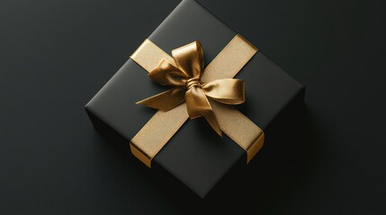Black gift box with golden ribbon and bow on a dark background.