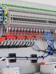 Electric screw through terminals are installed in a metal case on a diner.