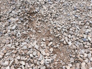 Textured sand with tiny stones, highlighting the raw beauty of a natural environment ideal for design elements