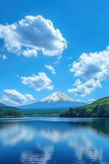 Obraz premium A mountain range is reflected in the water of a lake