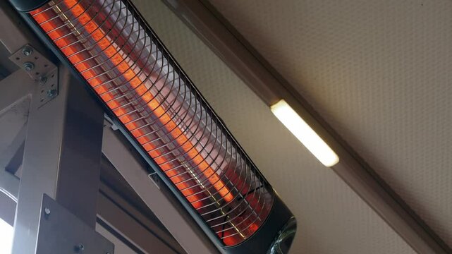 Modern electric infrared heater on celling 