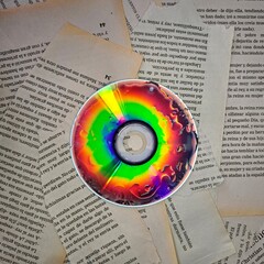 This vibrant, surreal photograph captures discs placed on weathered paper, illuminated by intense...