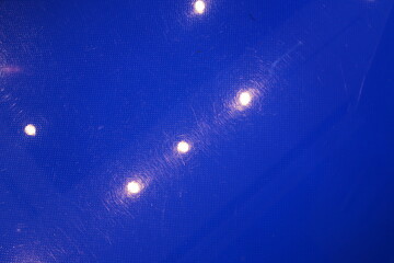 Bright lighting of buildings and structures close-up. Abstract drawings and backgrounds.