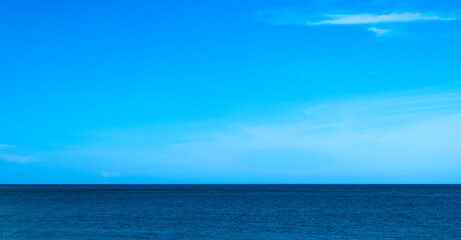 Nature of the beach and sea Summer with sunshine, sandy beaches, clear blue waters sparkling against the blue sky. On an island with good ecology and environment Background for summer vacation concept