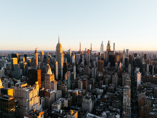 An aerial photo of Manhattan's upper downtown from above during the sunrise. New York, USA.