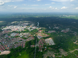 Aerial drone view of Chatin Lake or Tasik Chatin surrounded by greenery trees at Mentakab, Pahang, Malaysia.