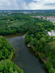 Aerial drone view of Chatin Lake or Tasik Chatin surrounded by greenery trees at Mentakab, Pahang, Malaysia.
