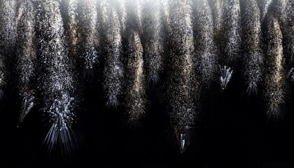 A black background with white and silver fireworks