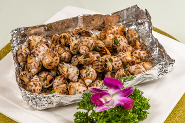 Close-up of salt-baked conch on a plate
