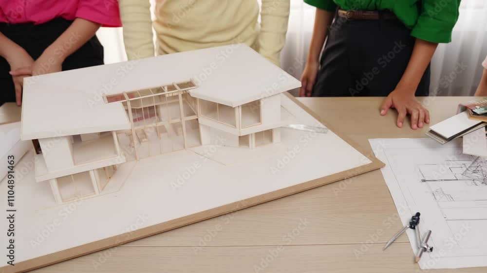 Poster slow motion home designer using architectural equipment draw a blueprint while interior designer sel