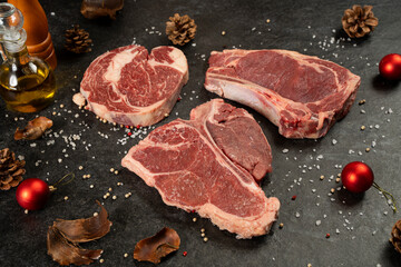 Raw t bone and rib eye steak with christmas deco