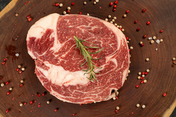 Raw rib eye steak with christmas deco