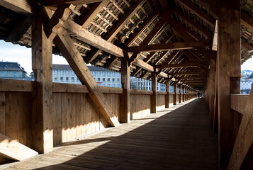 Detail of the Kapellbrücke (Chapel Bridge), a historic covered wooden footbridge and major landmark spanning the Reuss River in the city of Lucerne, Switzerland.