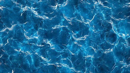 Overhead shot of blue water texture with reflections, similar to a swimming pool surface