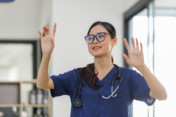 Portrait of young asian attractive female doctor or nurse smiling and standing in hospital 