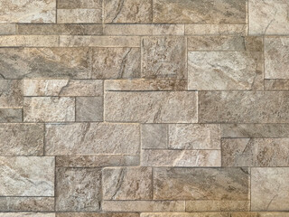 Random light beige cream natural flagstone and limestone cut in small rectangle shapes and square...