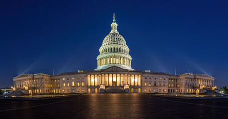 Fototapeta premium Panorama of the illuminated United States Capitol in Washington DC at night