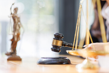 Lawyer business woman working with law book in office or courtroom Legal counsel with gavel and...
