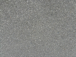 The texture of gray asphalt on a road