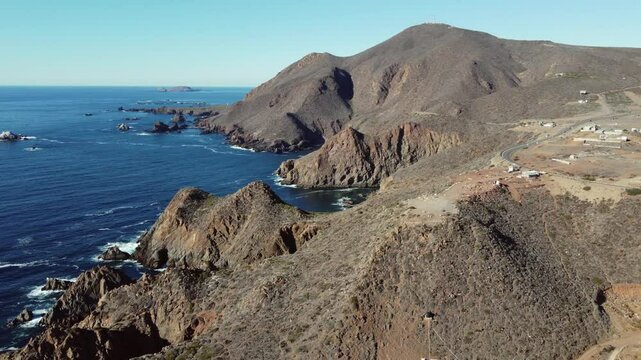 Aerial view of dry rugged ocean coast at La Bufadora in Baja Mexico