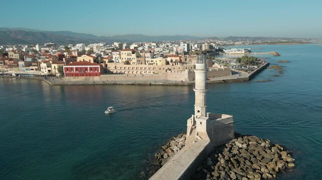 Drone Pulls Away From Chania Lighthouse And Waterfront On The Greek Island Of Crete 4K 60FPS